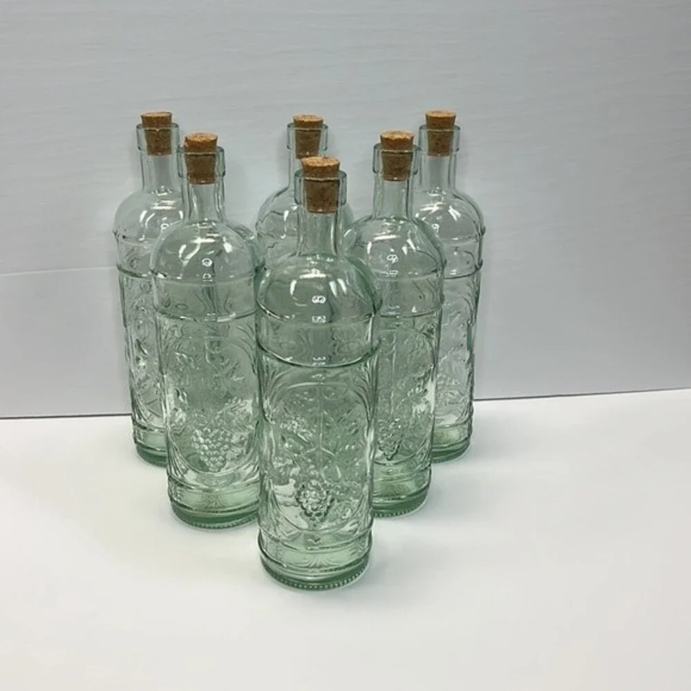 William Sonoma made in Spain Embossed Clear Green Glass Bottles set of 3